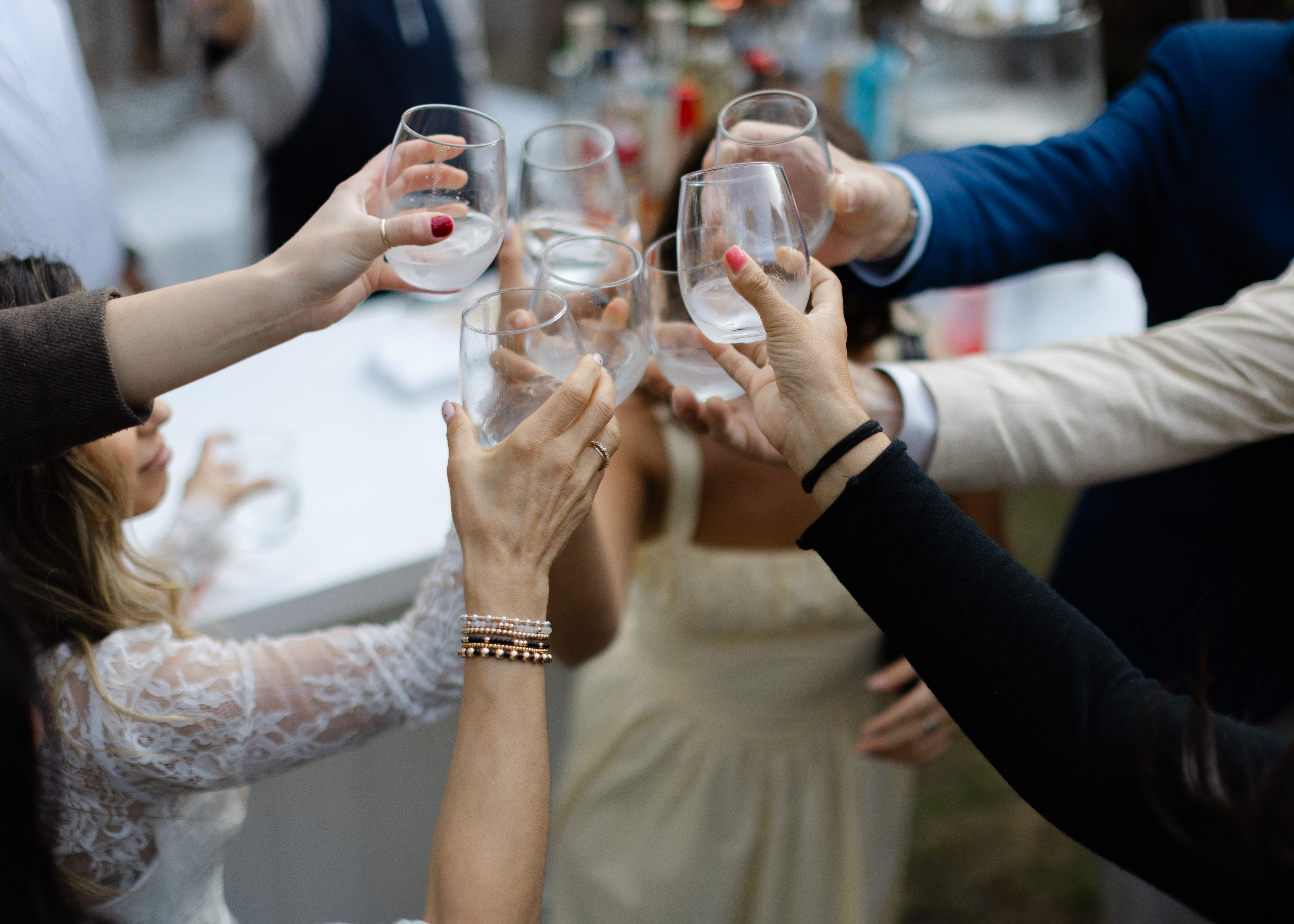 a group of people holding wine glasses