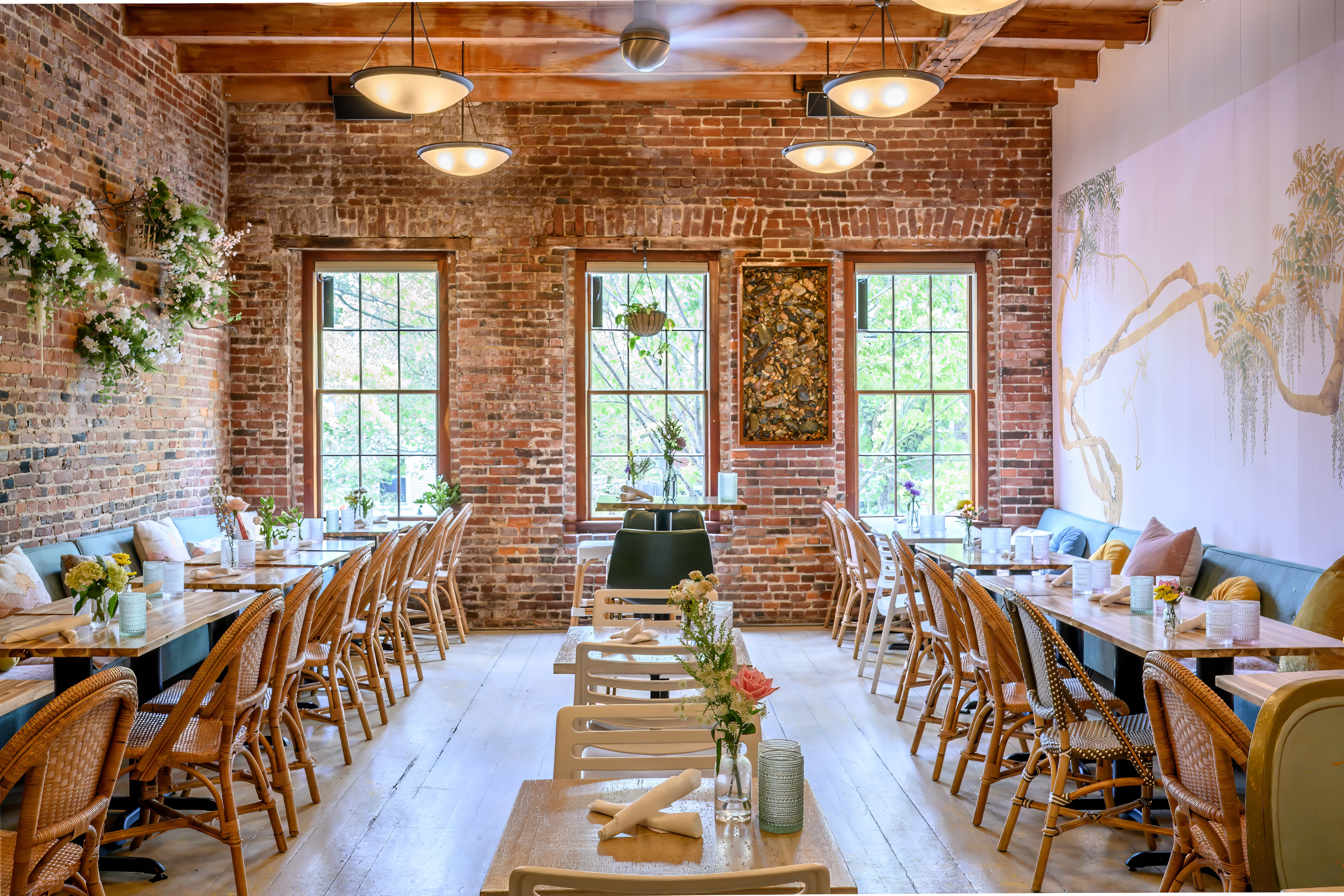 a living room filled with furniture and a large window