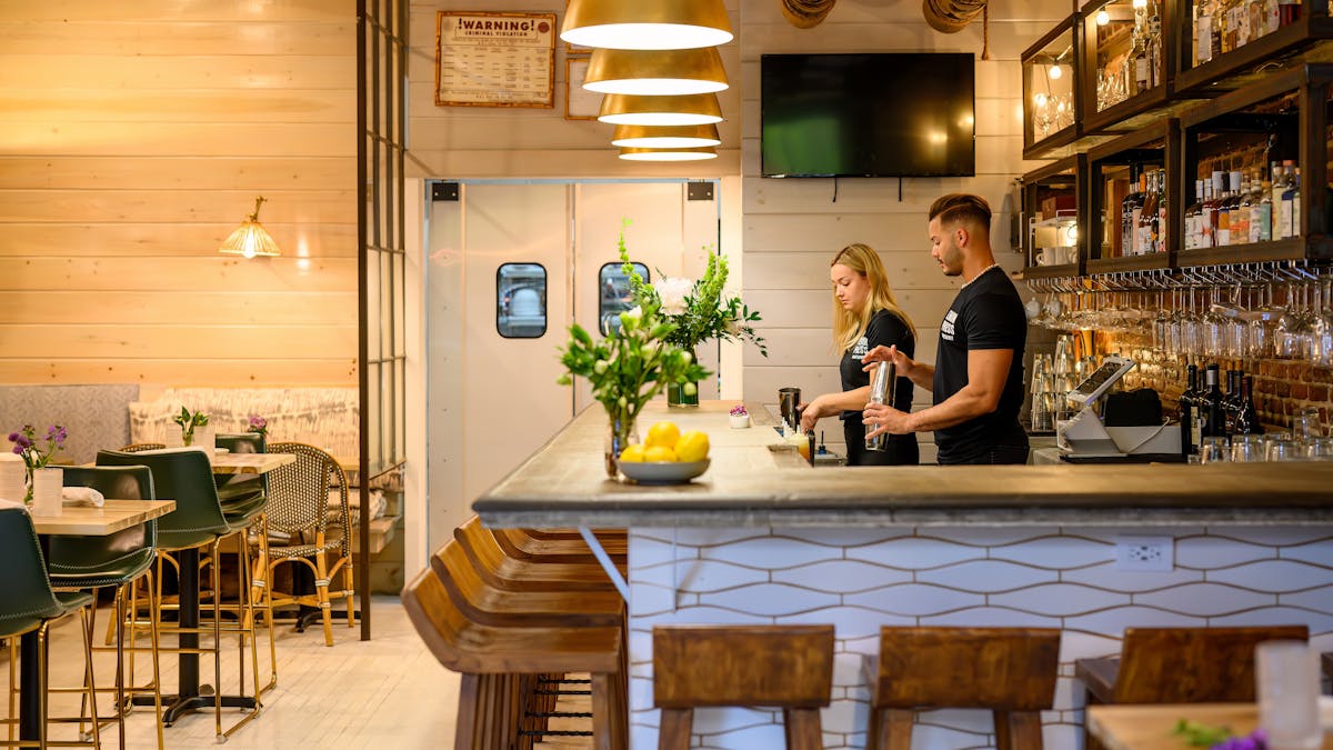 a person sitting at a table in a restaurant