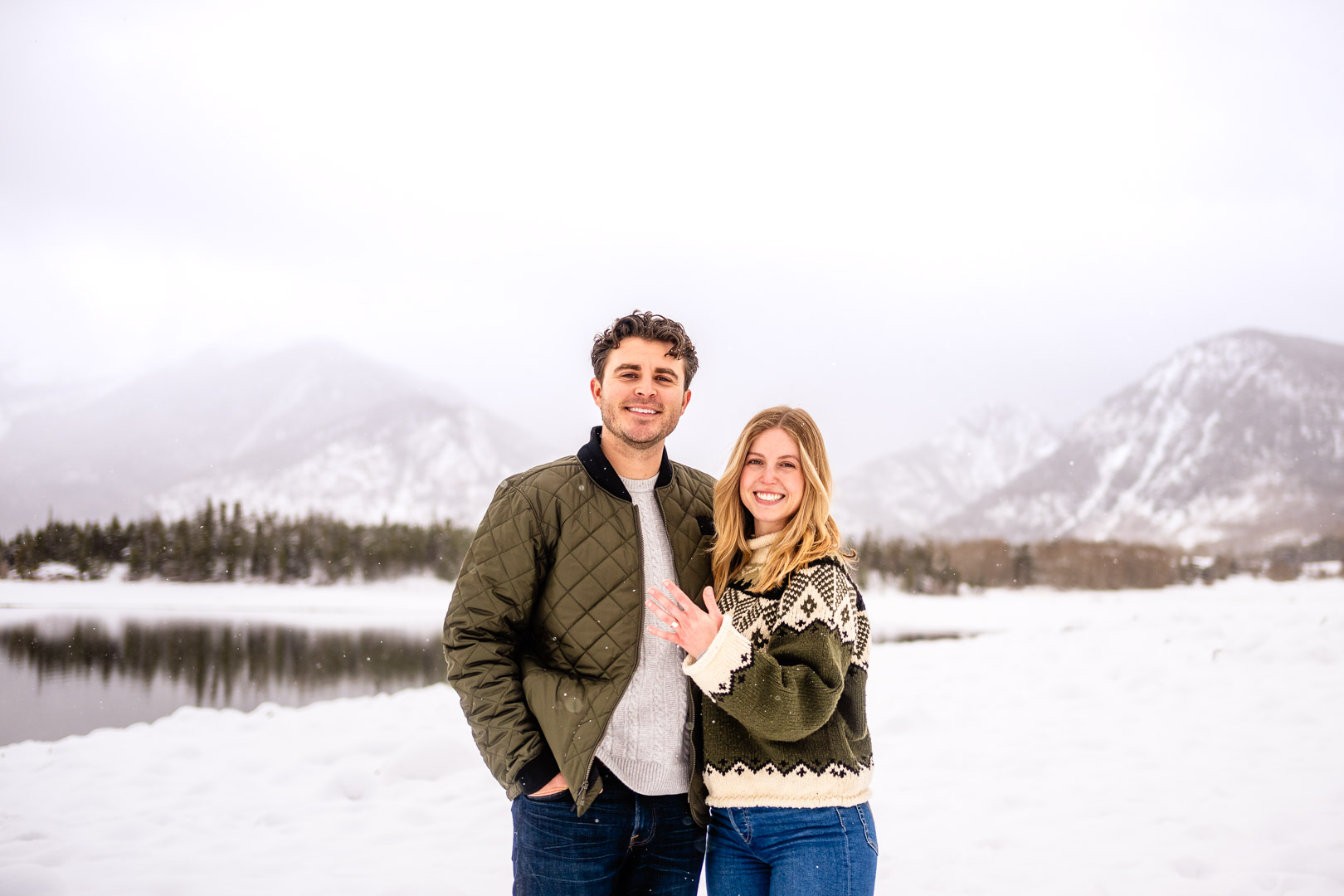 a person standing on a snow covered mountain