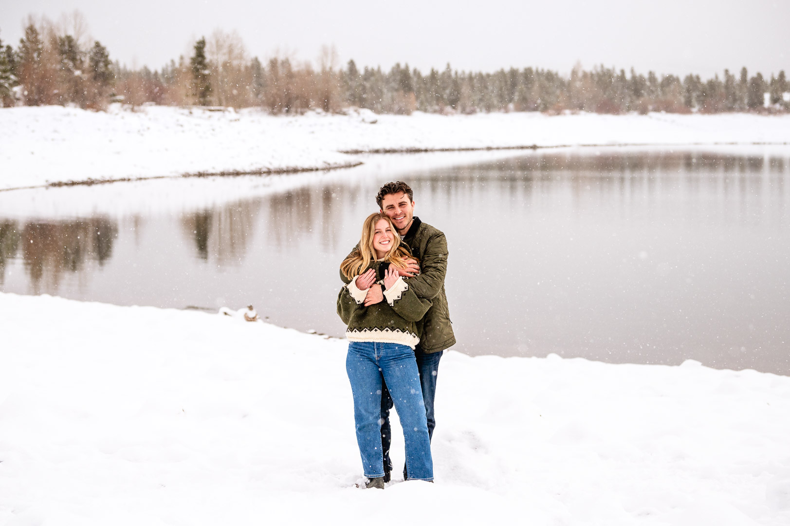 a man that is standing in the snow