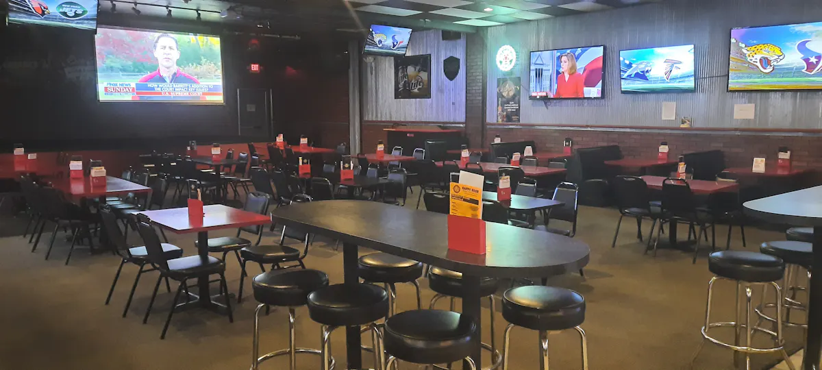 a group of people sitting at a table in a room