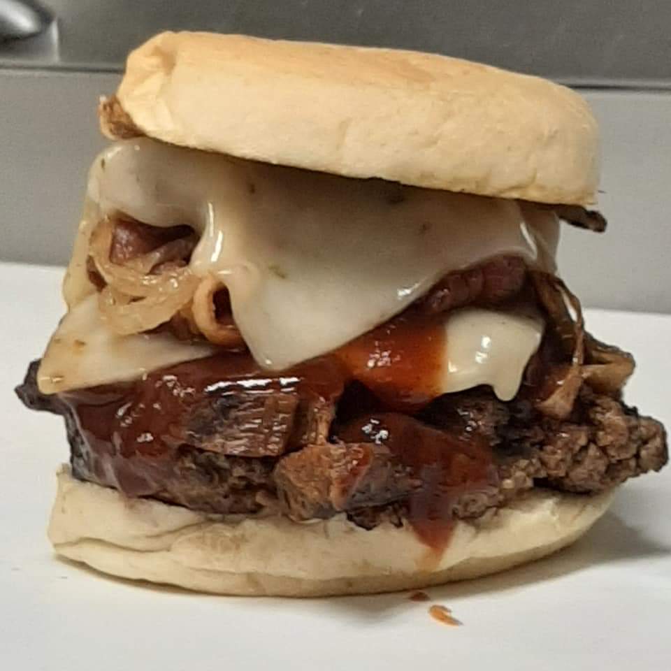 a sandwich sitting on top of a plate of food