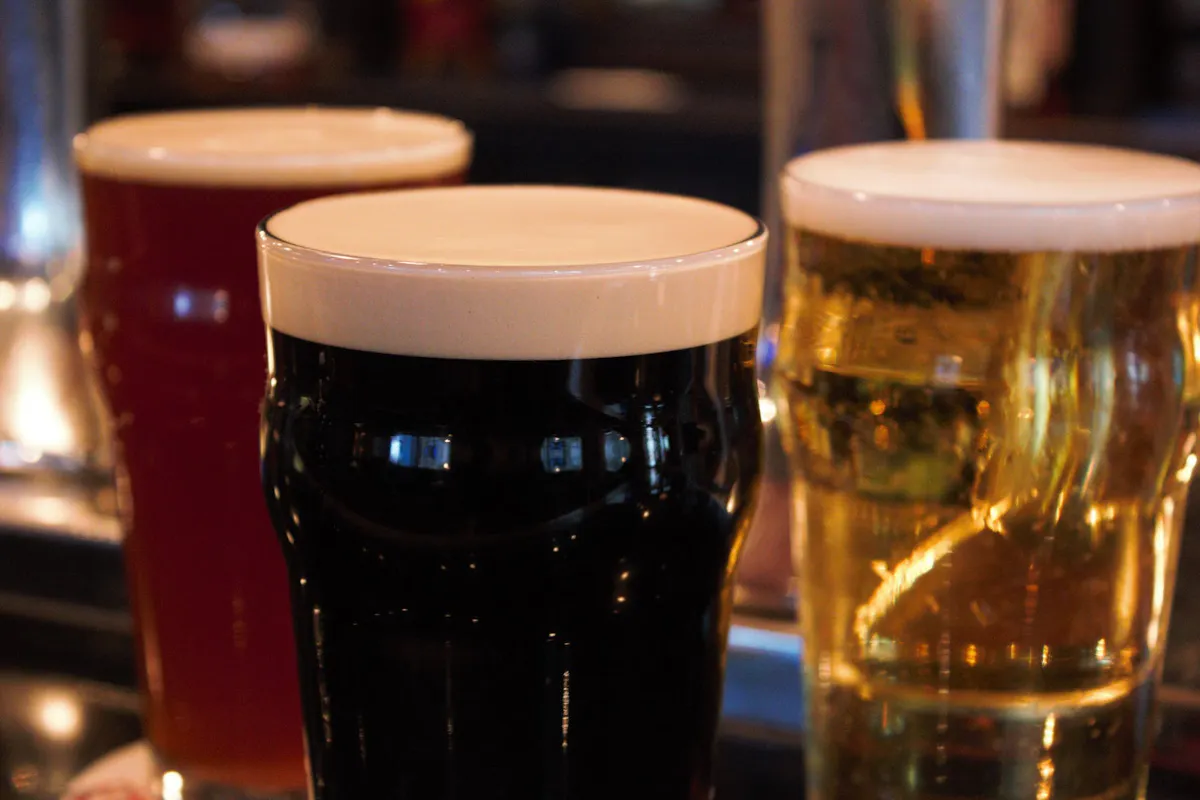 a close up of a glass of beer on a table