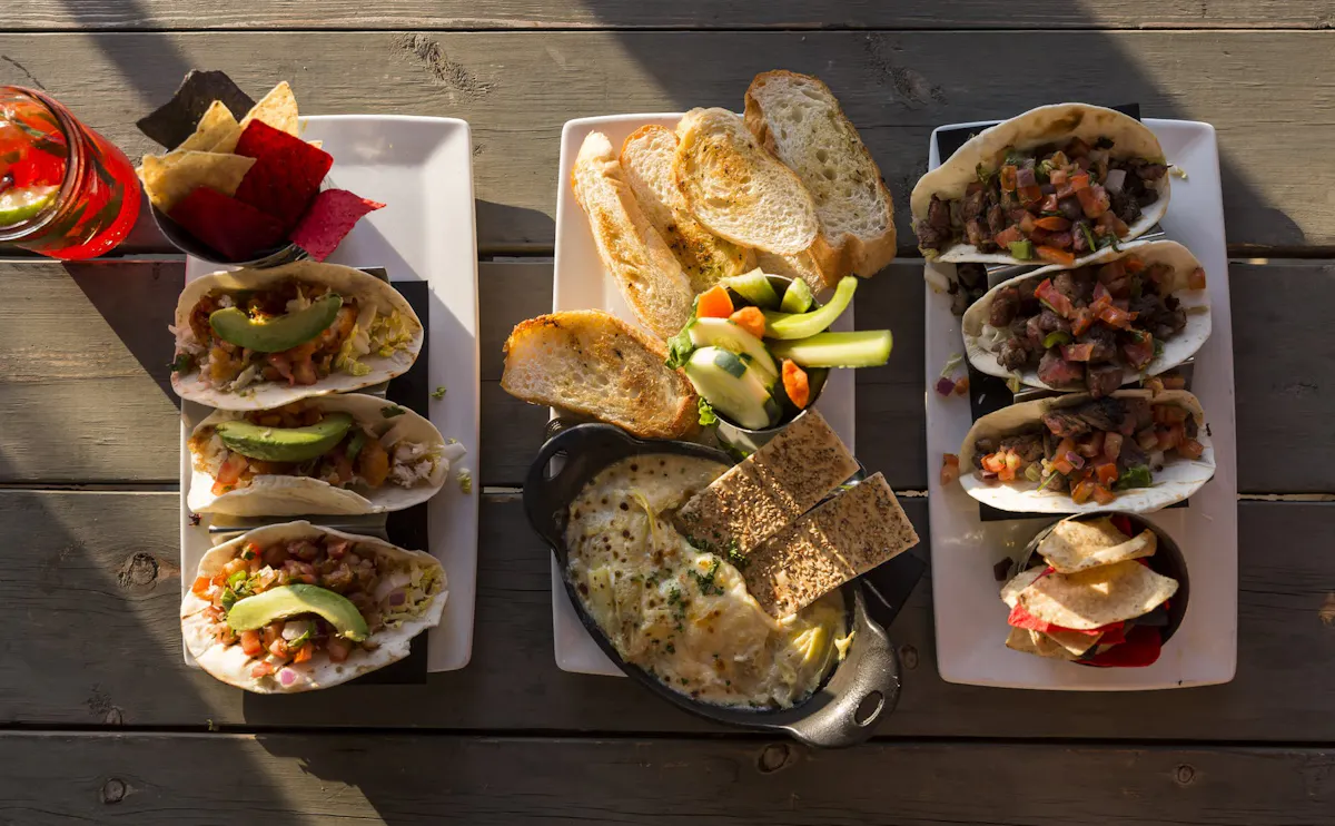 a bunch of different types of food on a table