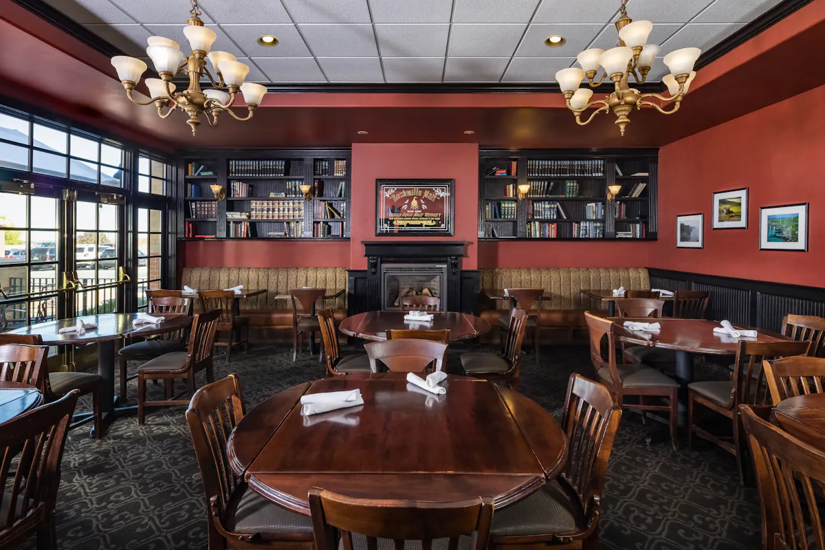 a room filled with furniture and a table in a restaurant