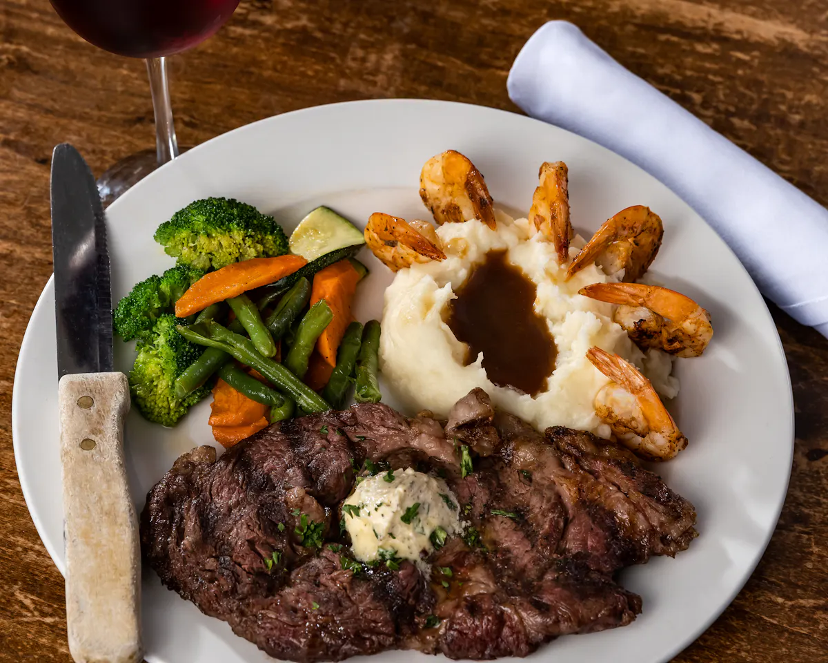 a plate of food with meat and vegetables