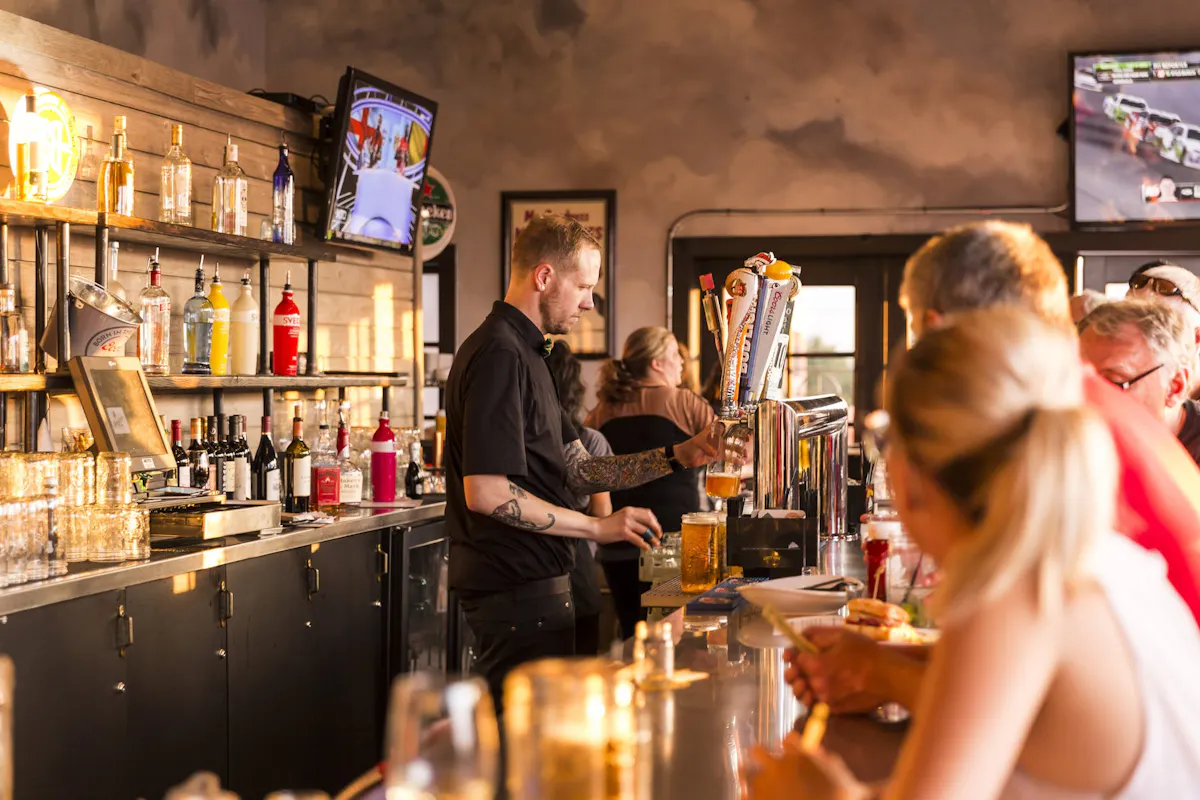a person standing in front of a restaurant
