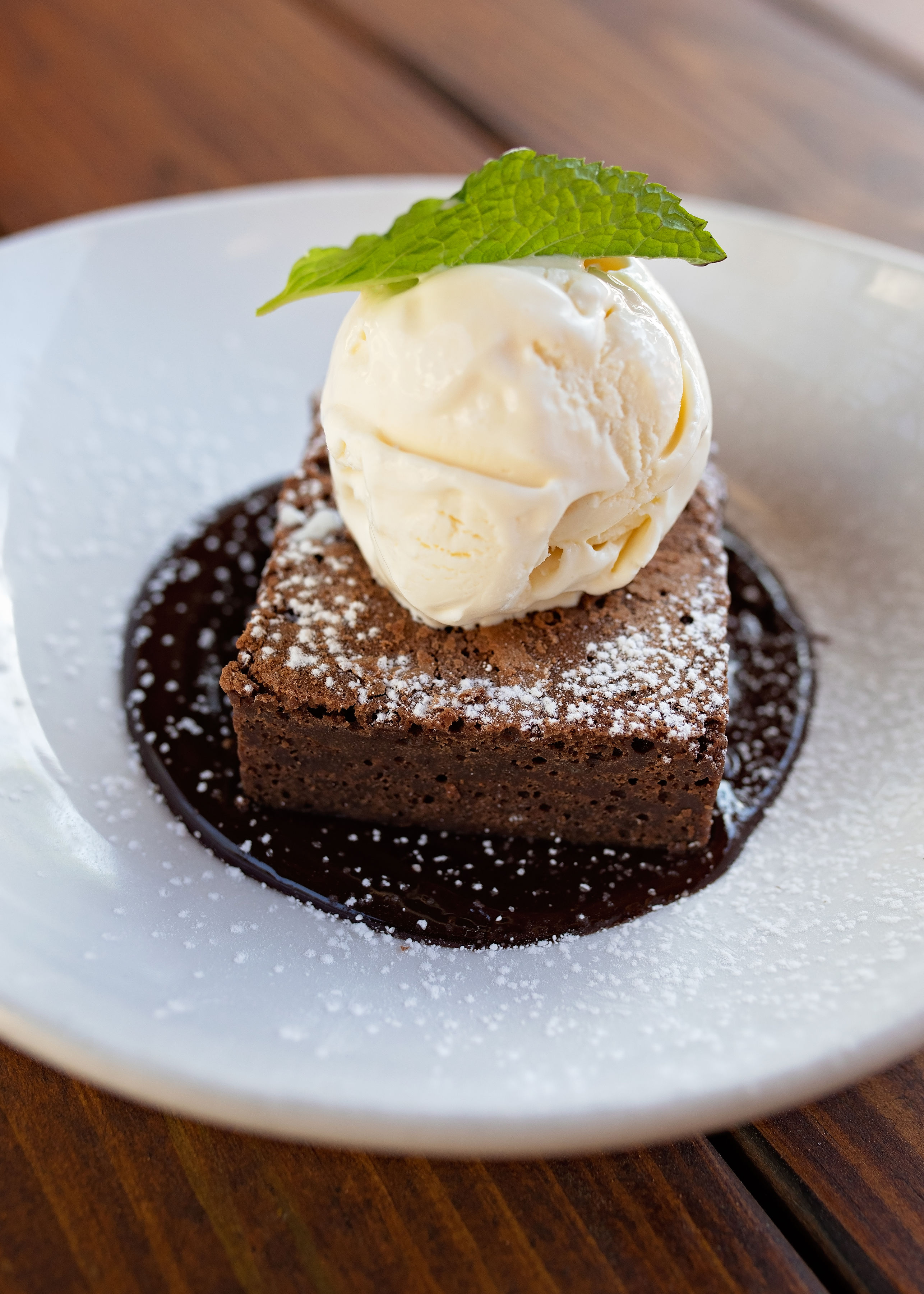 a piece of cake and ice cream on a plate