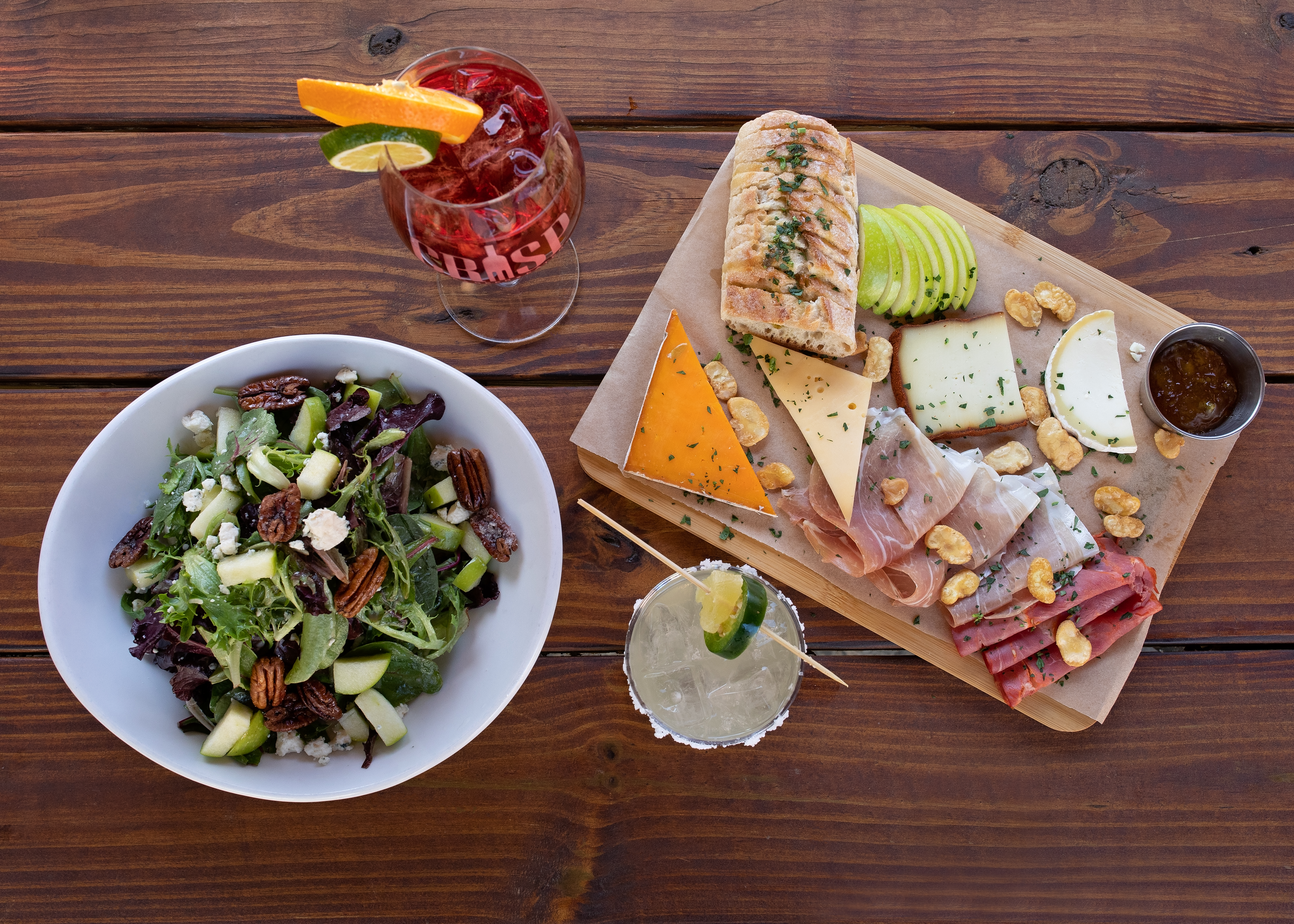 a plate of food sitting on top of a wooden table