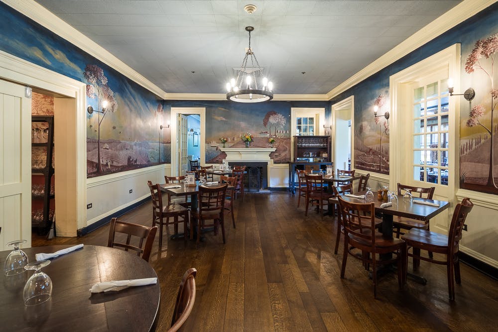 a kitchen with a dining room table