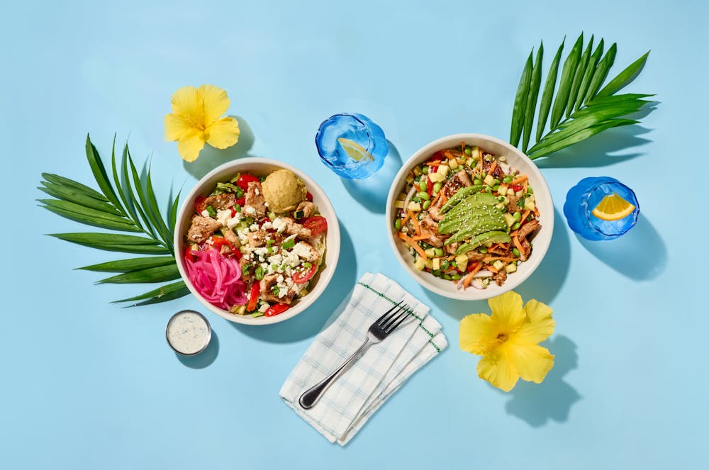 two protein bowls with two glasses of water on a tsble
