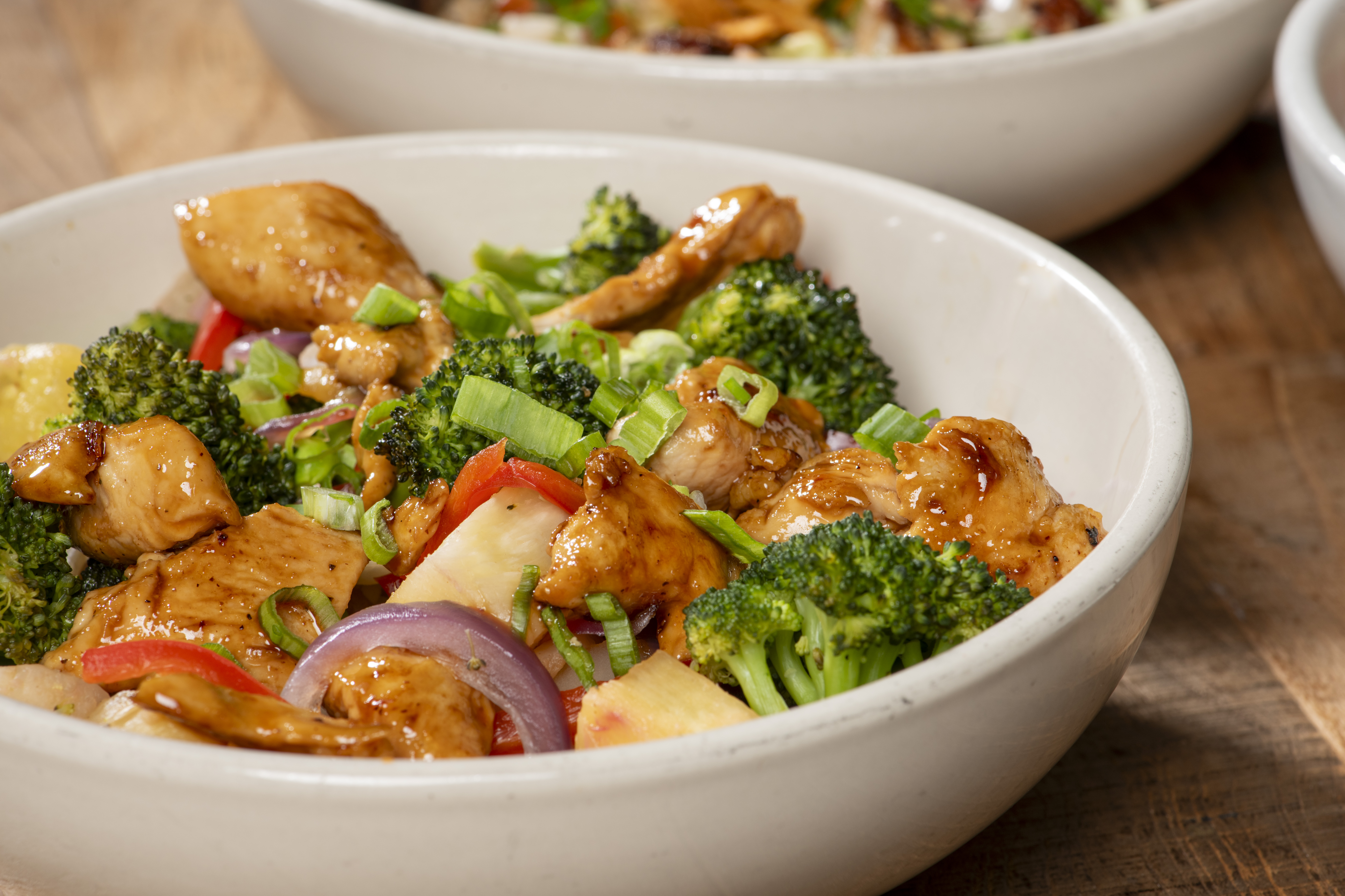 a bowl of food with broccoli