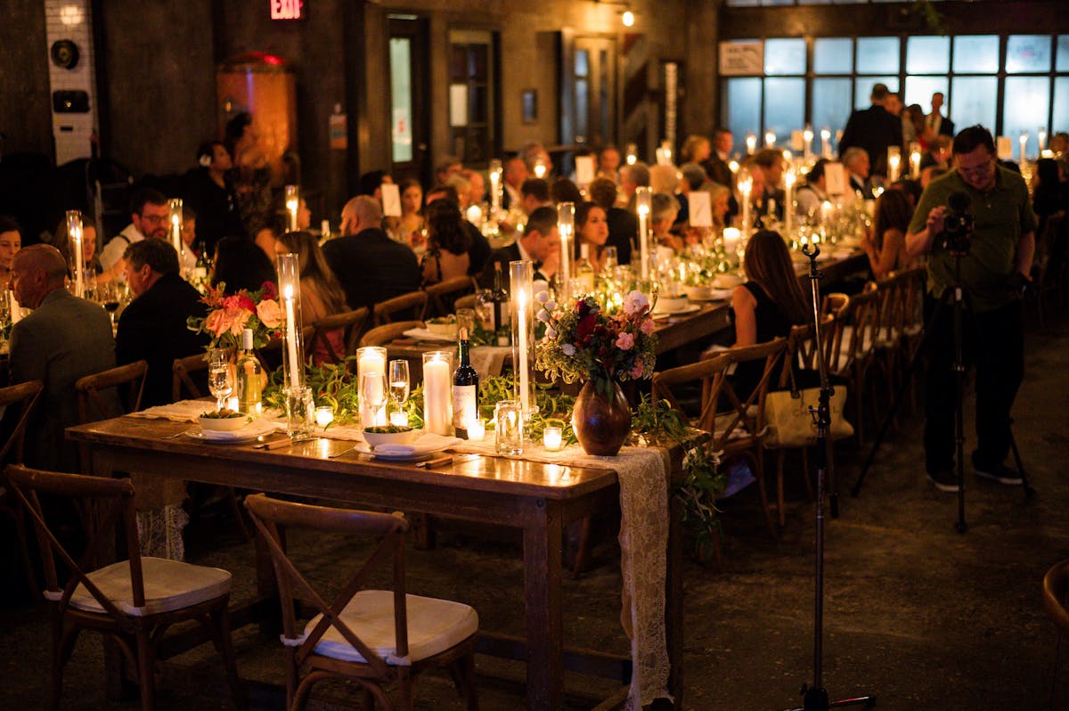 a group of people sitting at a table with wine glasses