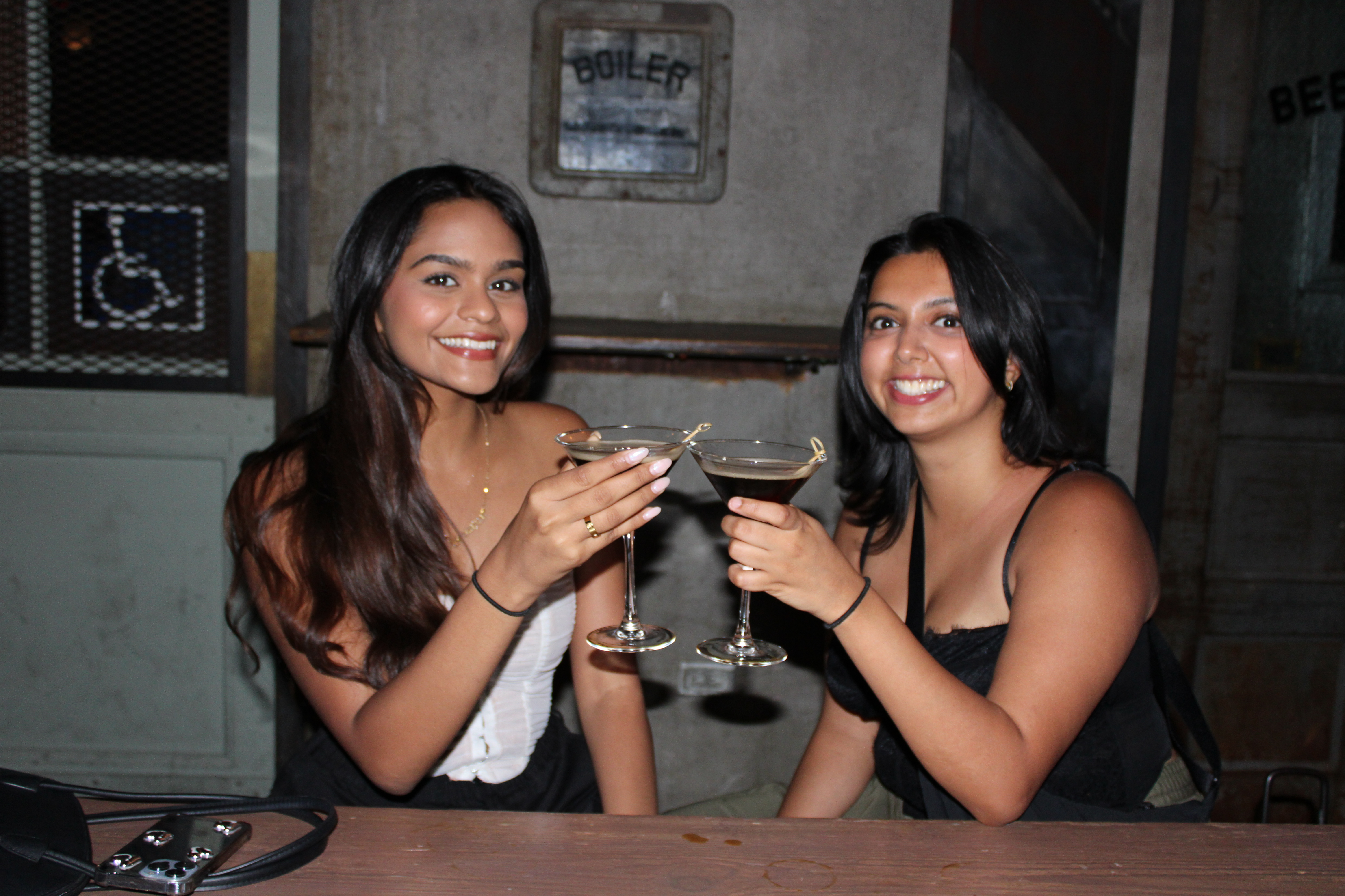 a woman drinking a glass of wine