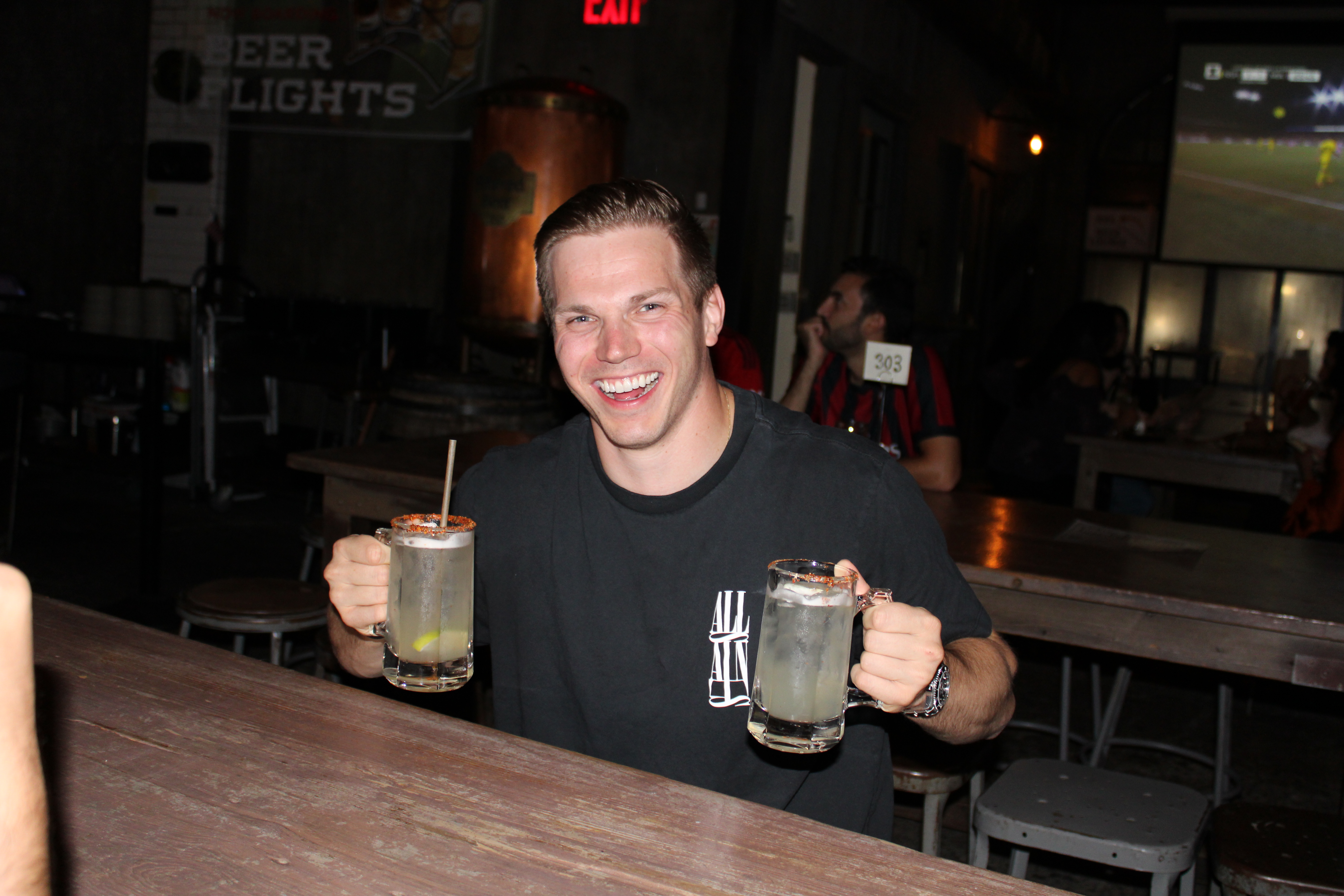 a person sitting at a table in a restaurant