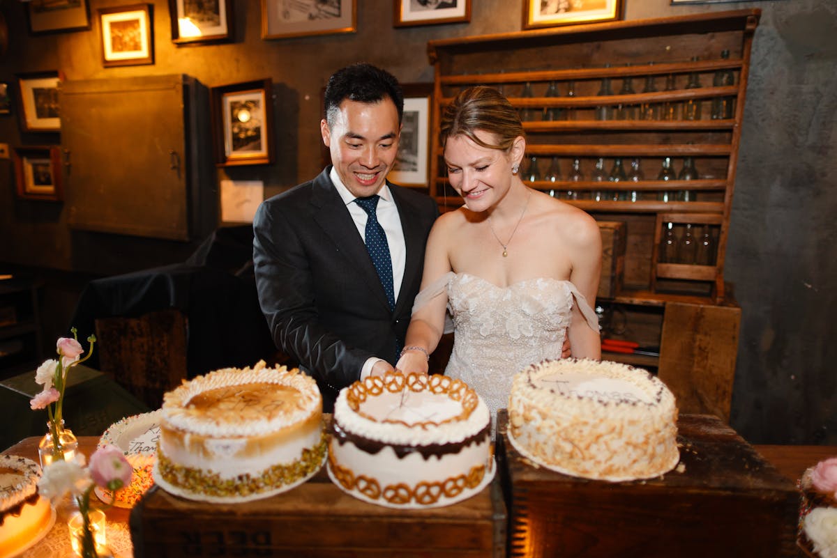 a person standing in front of a cake