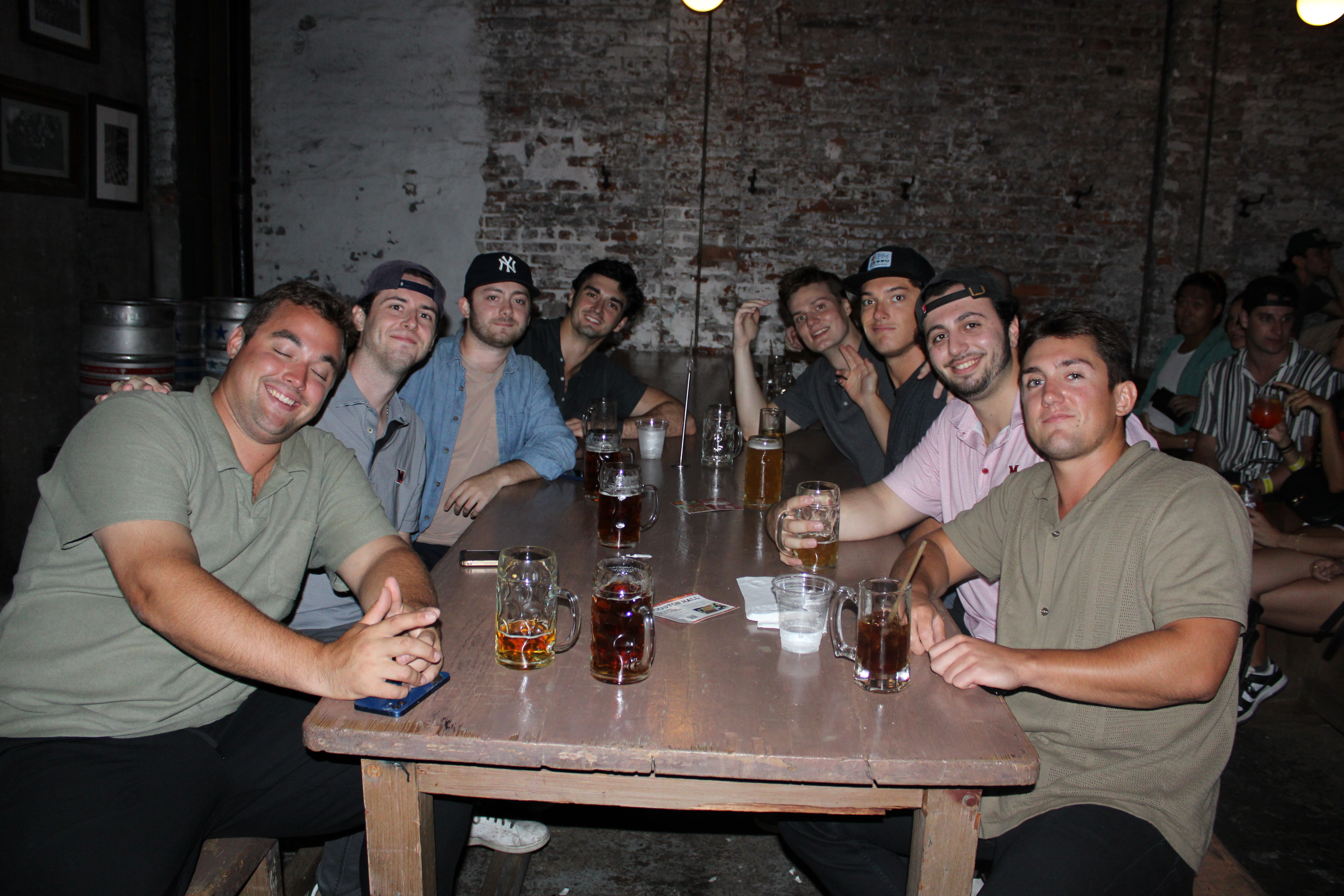 a group of people sitting at a table with wine glasses