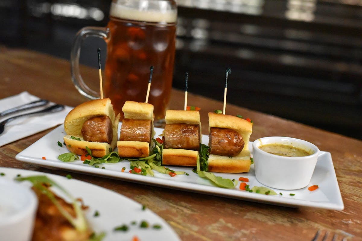 a bratwurst cut into pieces on a plate