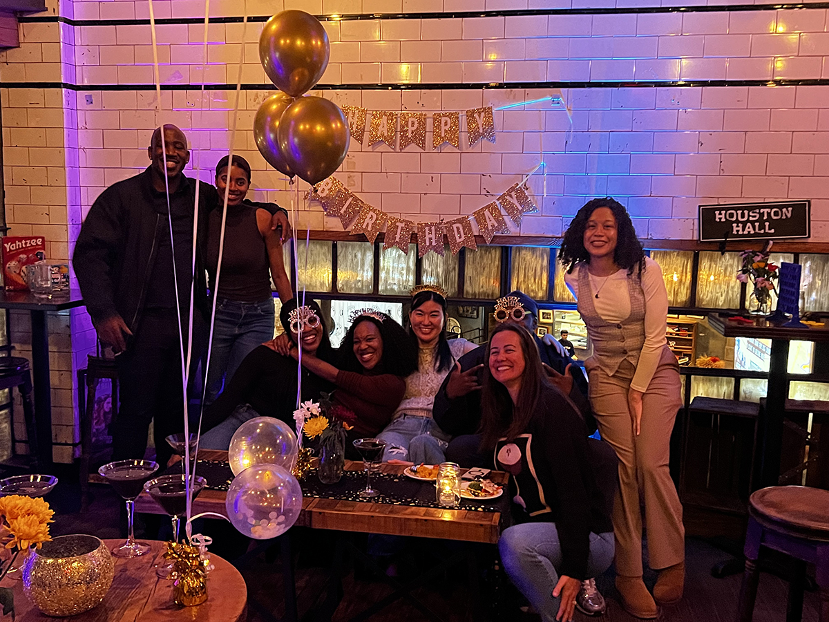 a group of people sitting at a table with wine glasses