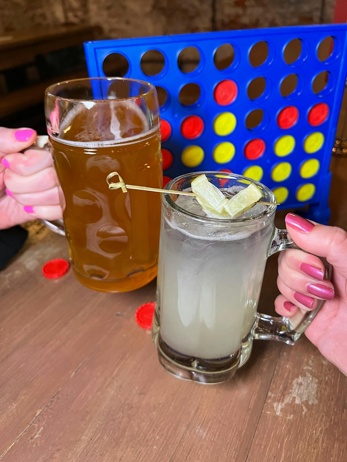 a cup of coffee and a glass of beer on a table