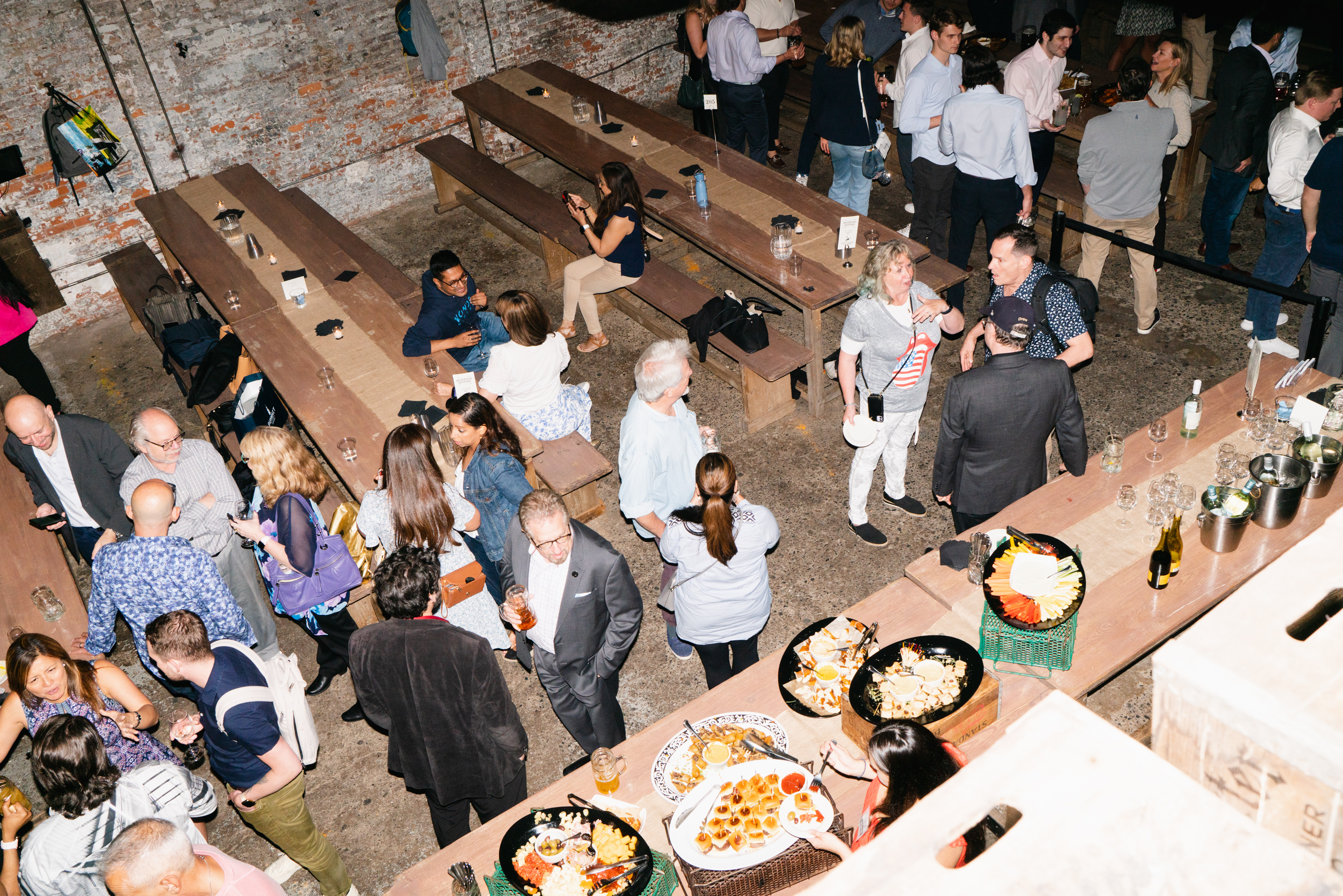 a group of people sitting at a table in front of a crowd