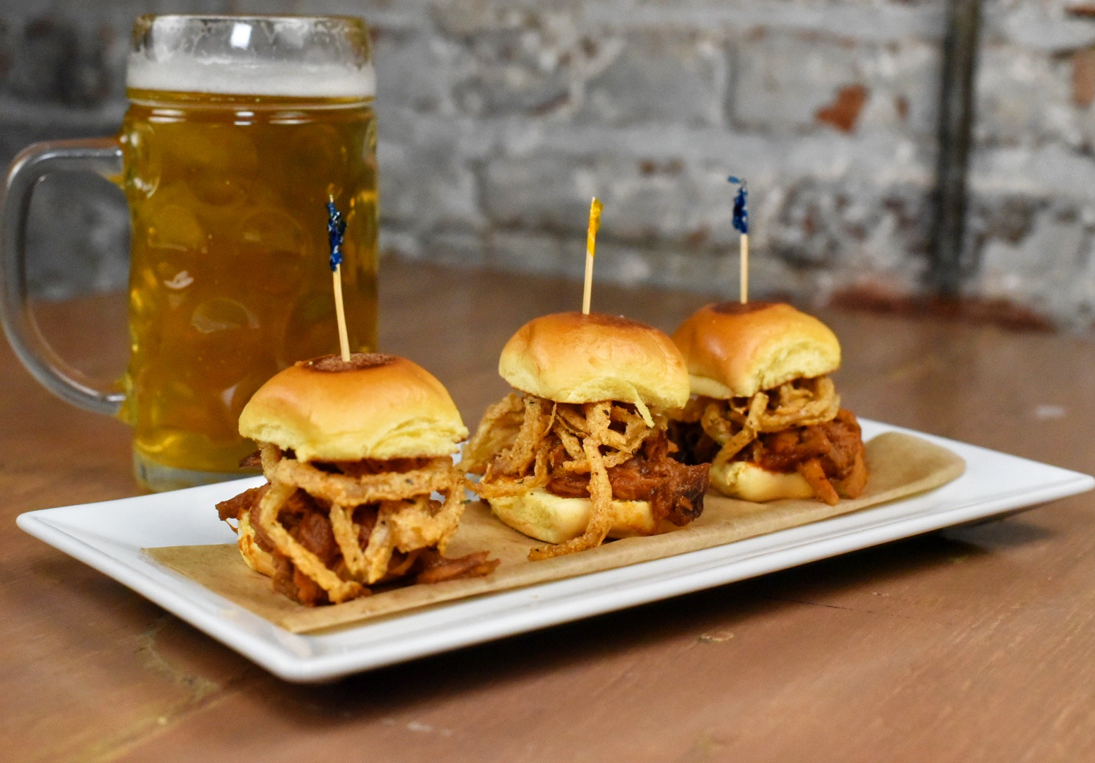 a glass plate topped with sliders