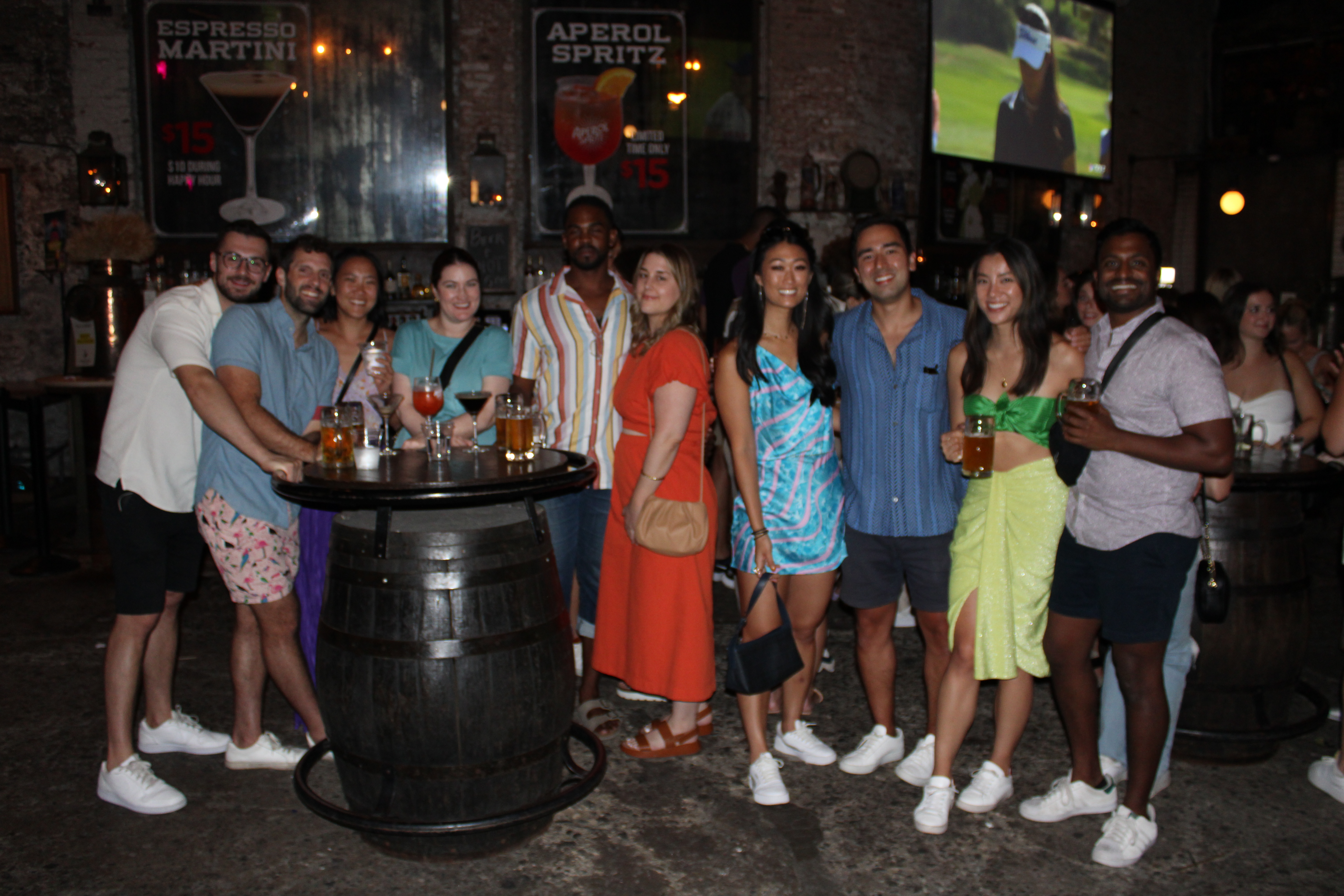 a group of people standing in front of a crowd posing for the camera
