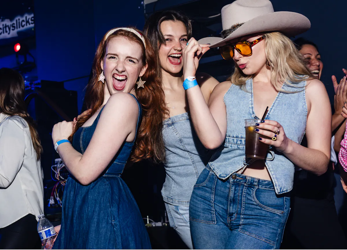 a group of women posing for a picture