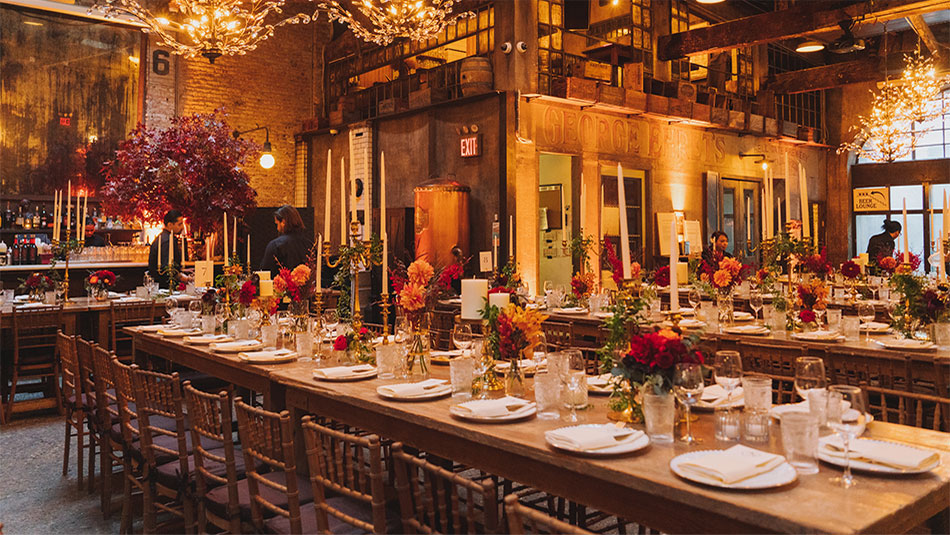 Staff preparing multiple long tables at our wedding venue in and near Chelsea, New York City.