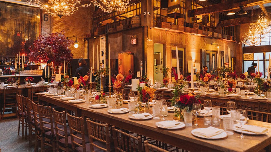 Staff preparing multiple long tables at our wedding venue in and near Midtown South, New York City.