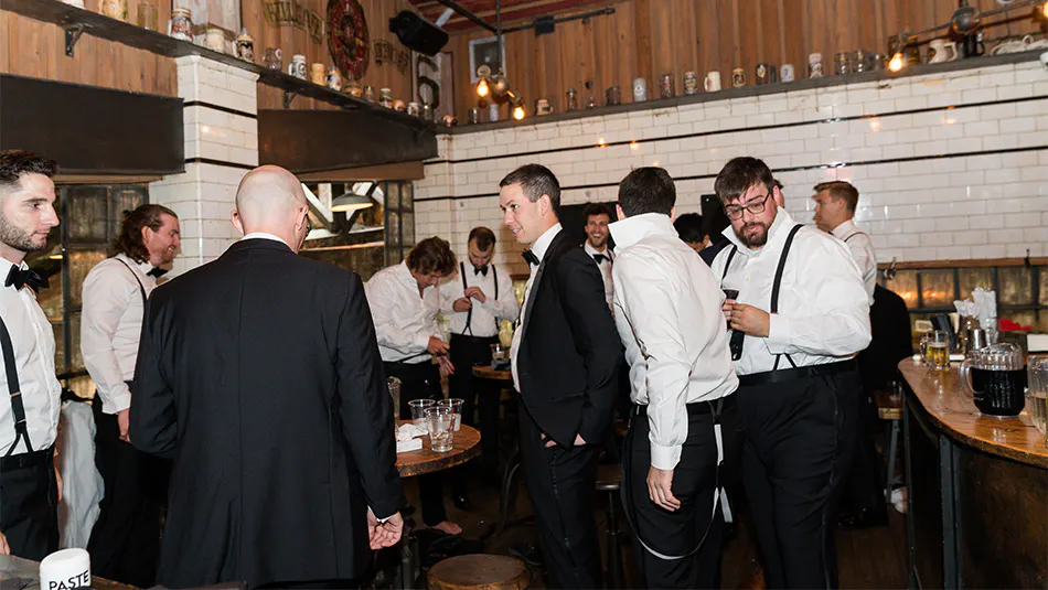 Groomsmen congregating in the VIP Tap Room at our NYC wedding venue.