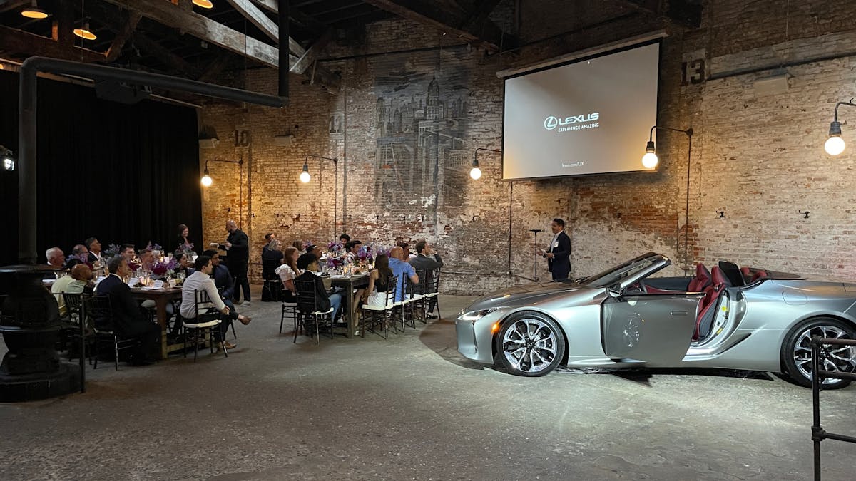 an event with a car on the floor of a bar