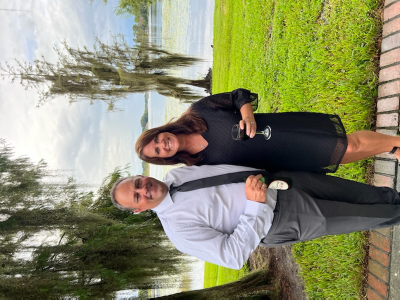 a person standing in front of a tree posing for the camera