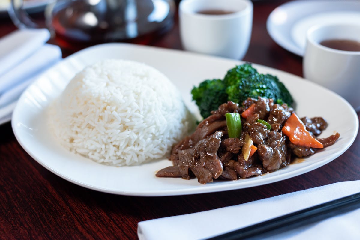 a plate of food and a cup of coffee