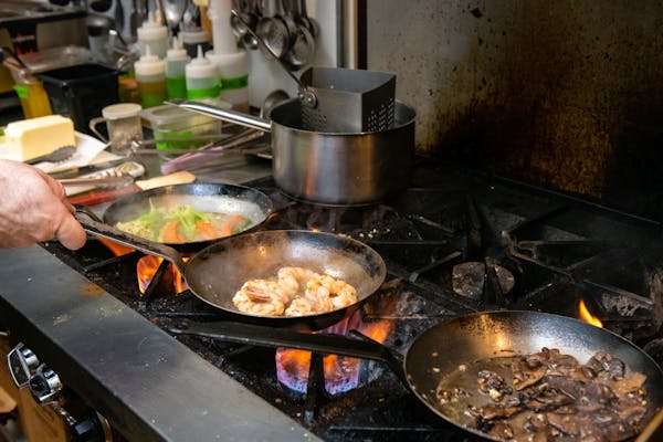 a pot of food cooking on a stove