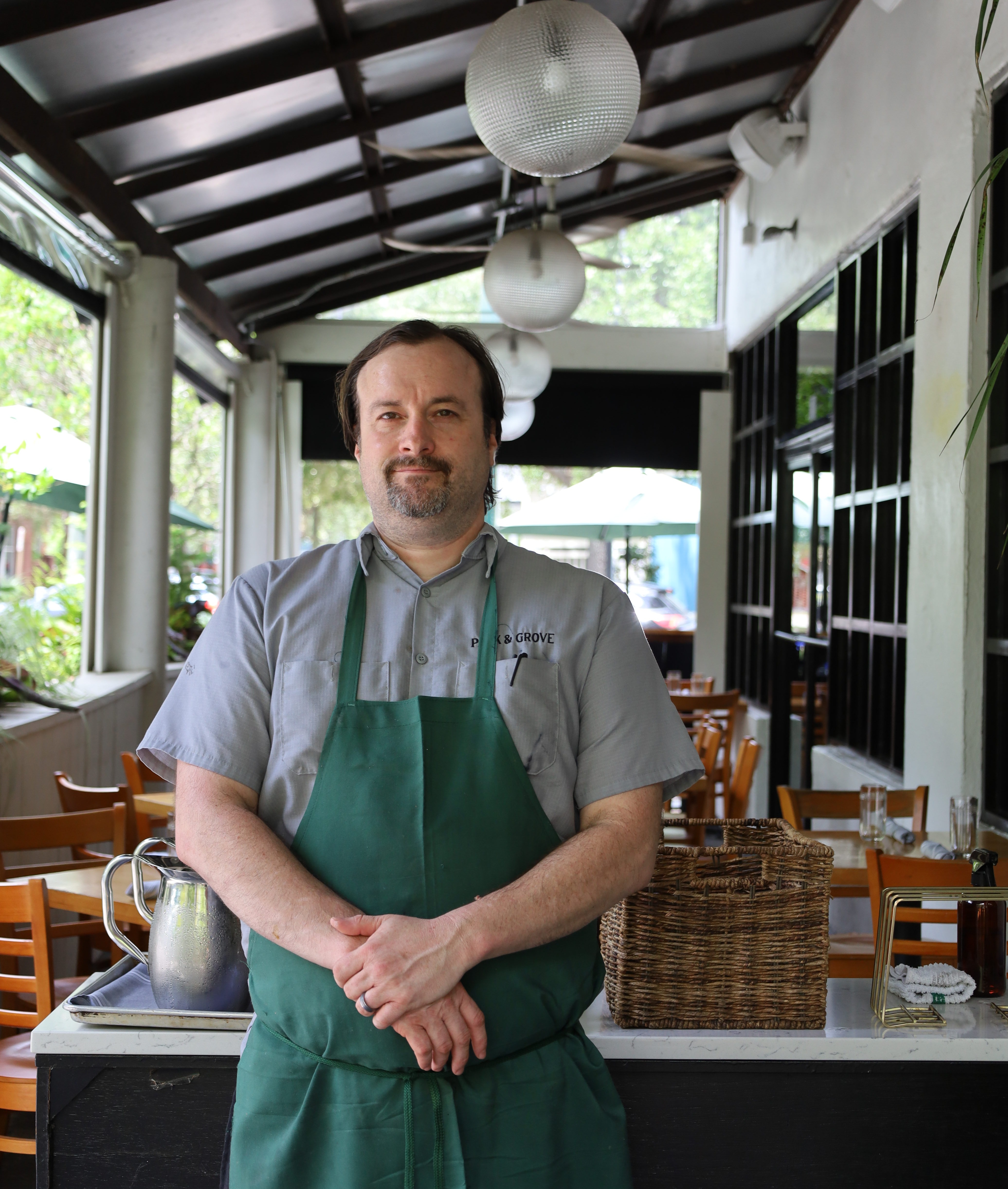 a man standing in front of a building