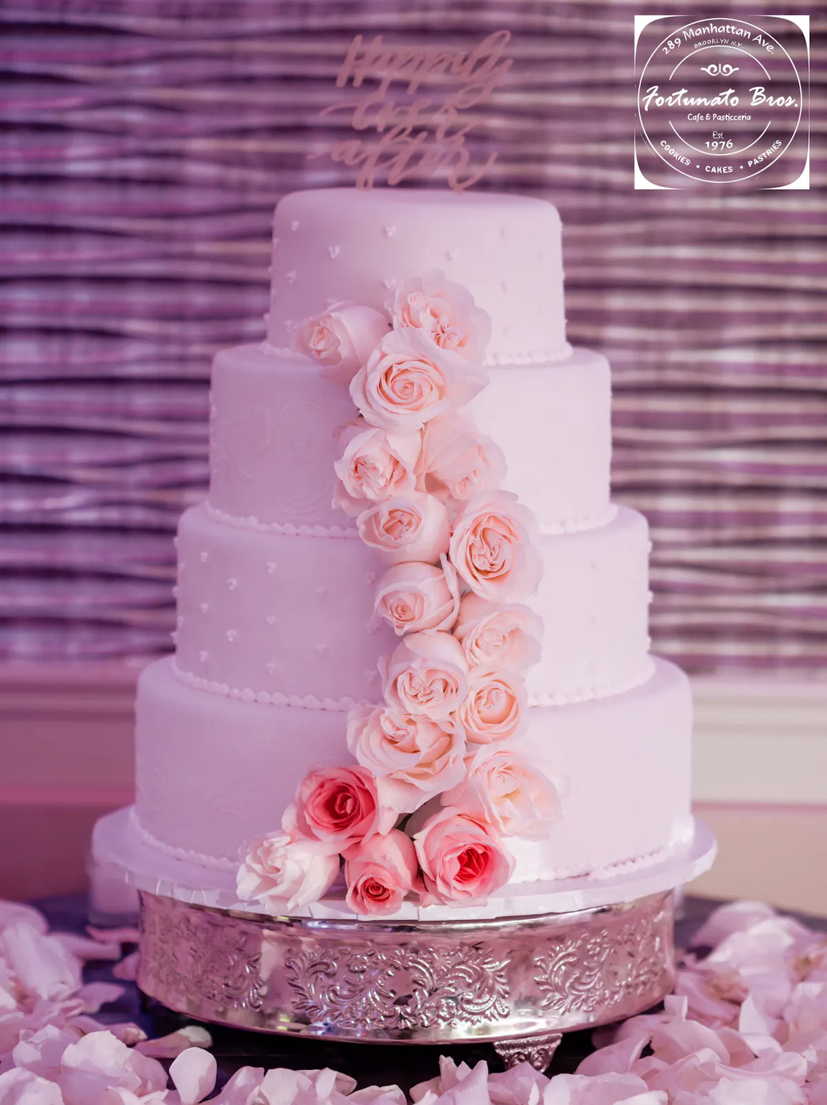 a couple cut into a wedding cake