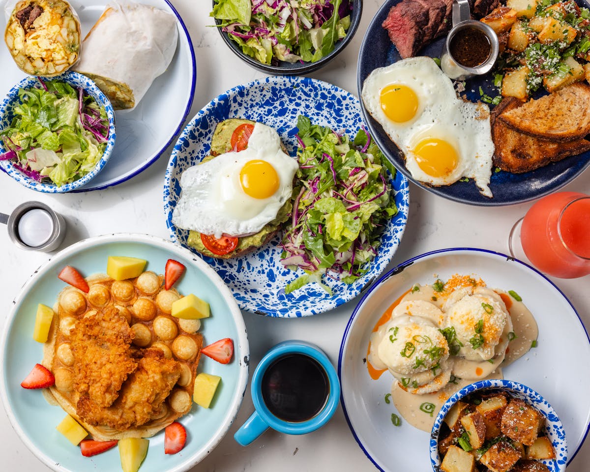 Whiskey Bird brunch includes chicken and waffles, avocado toast, eggs benedict on bao bun