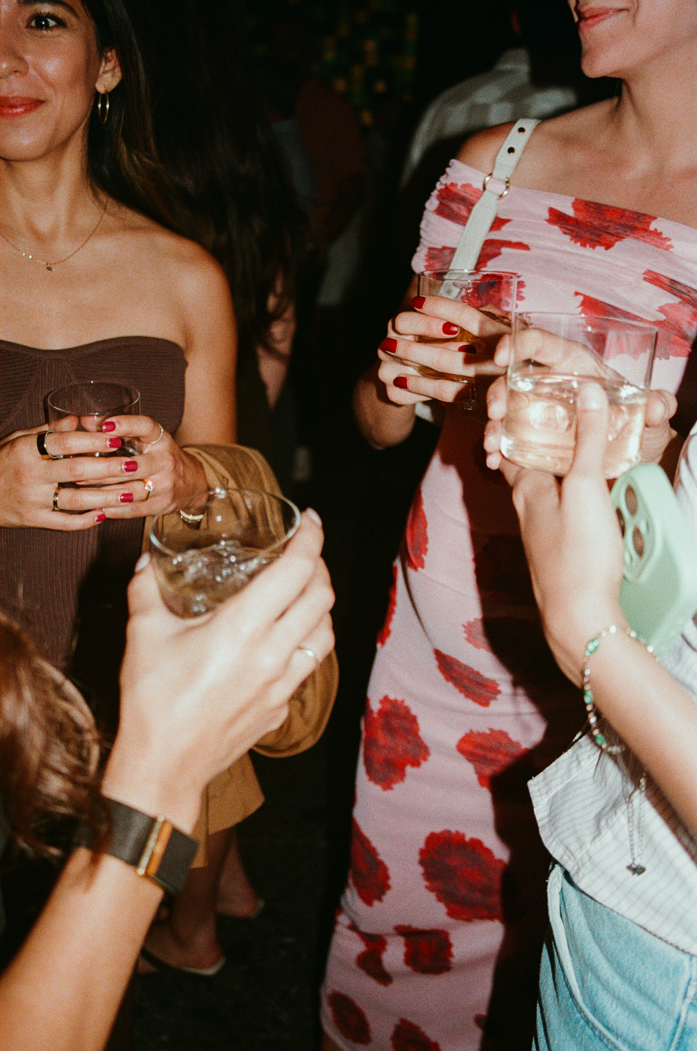 a group of people holding drinks