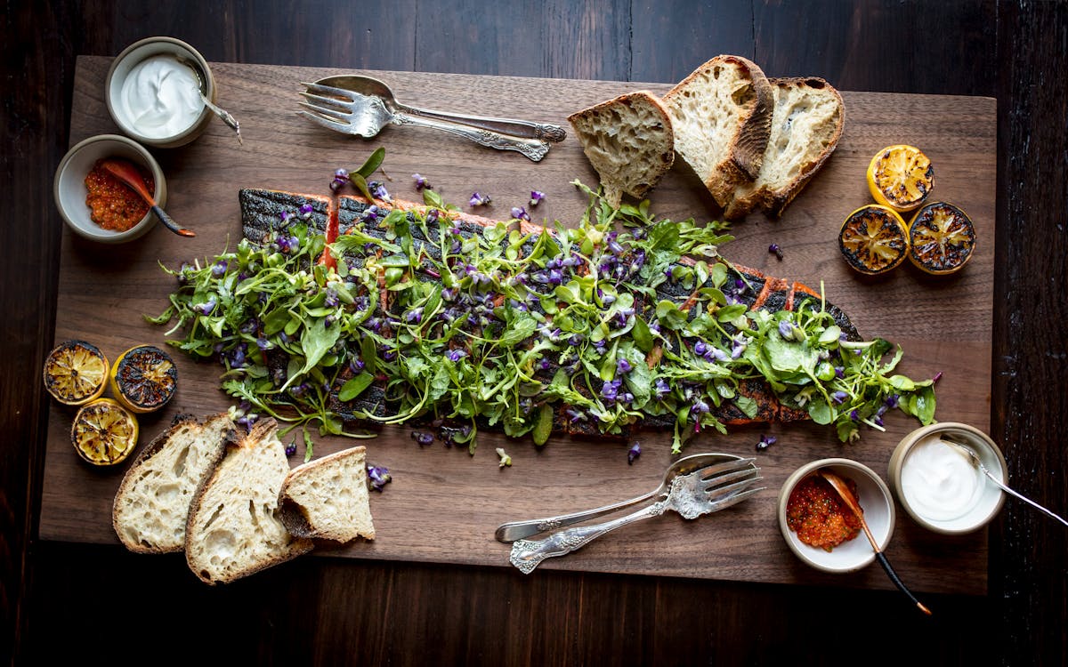 a bunch of food sitting on top of a wooden table