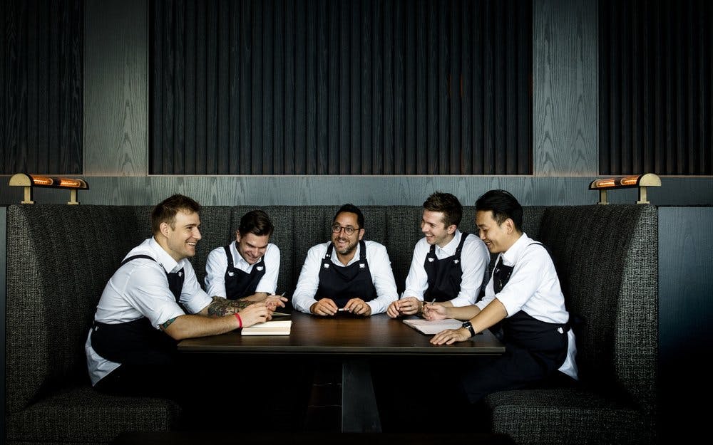 Christopher Kostow et al. sitting at a table