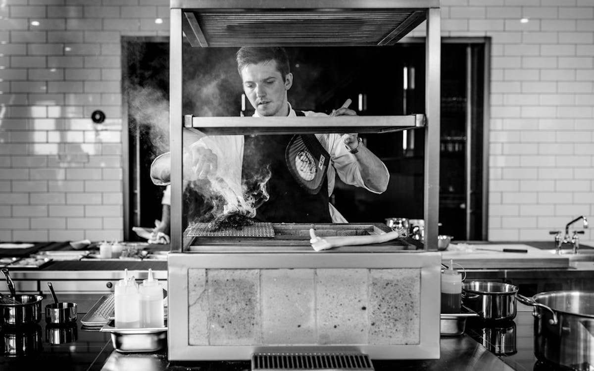 a person cooking in a kitchen