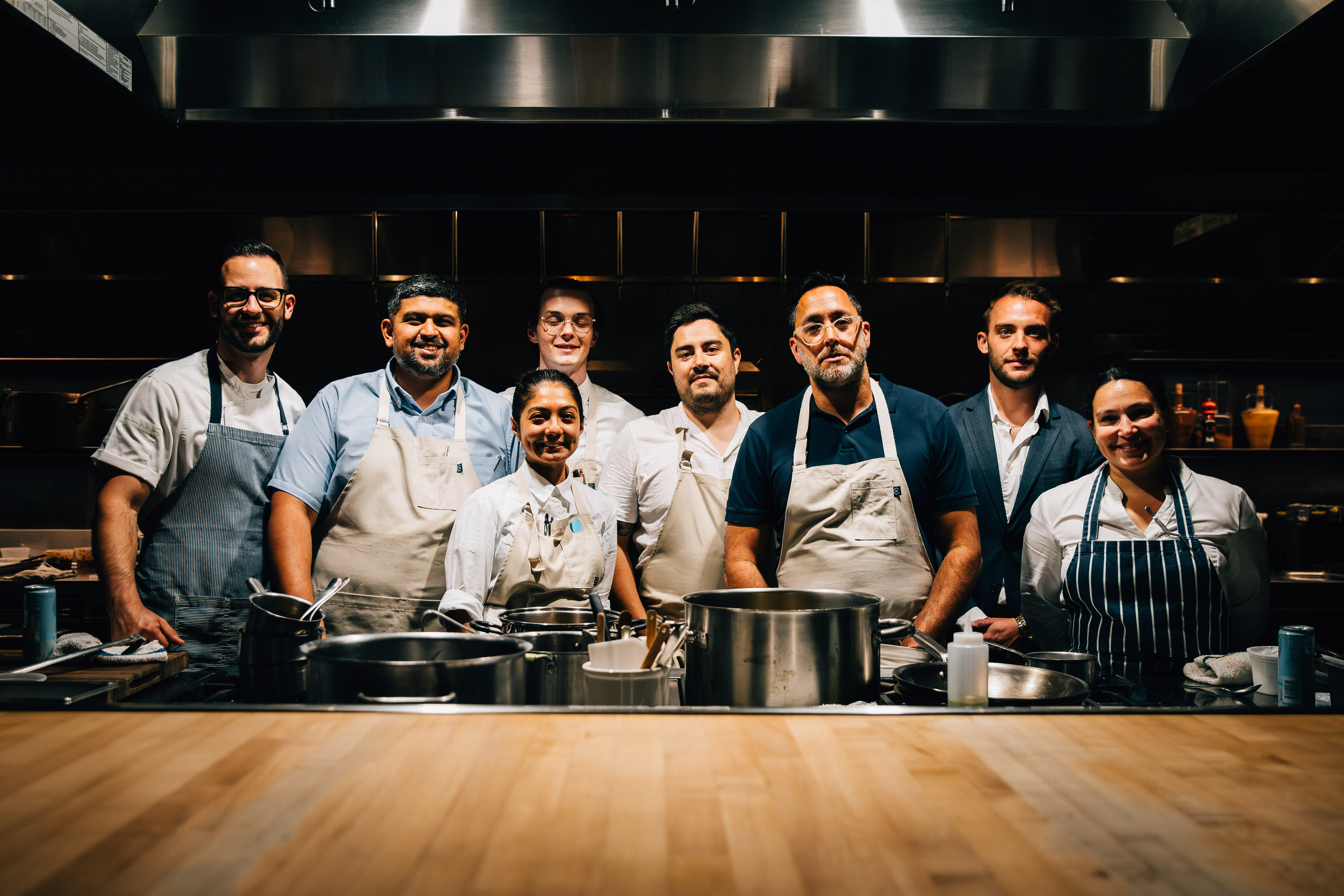 team kostow smiling in the ojai kitchen