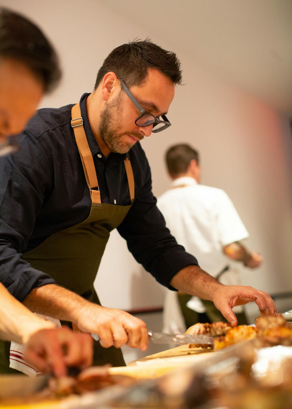 a man preparing food in a kitchen