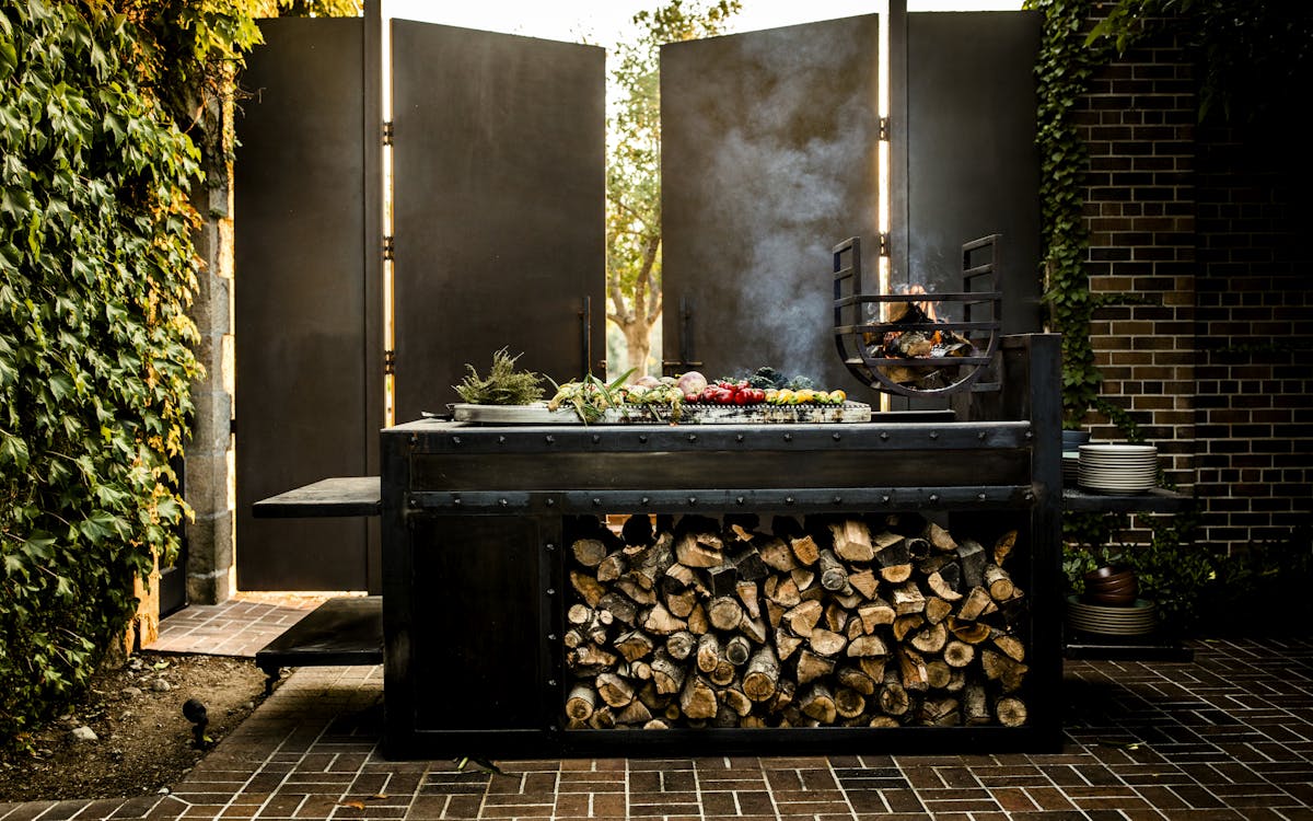 a kitchen with wooden cabinets and a fireplace