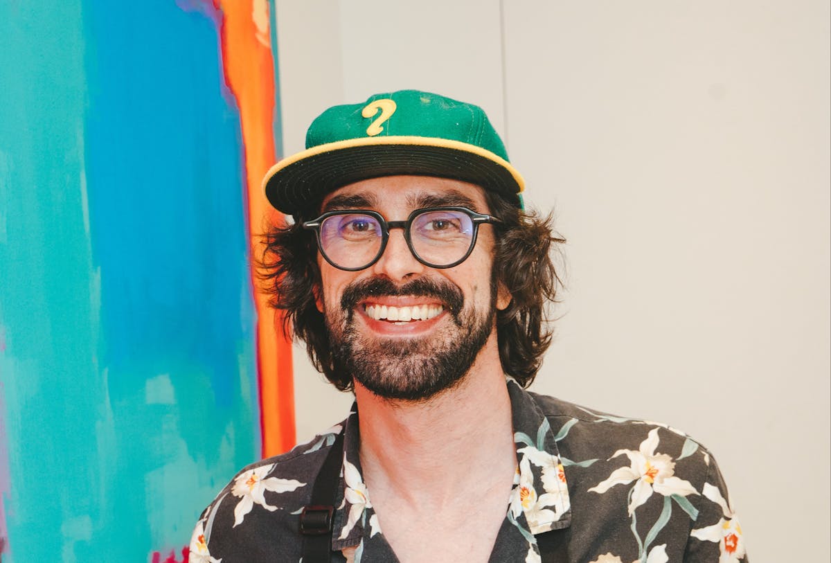 a man wearing a hat and glasses