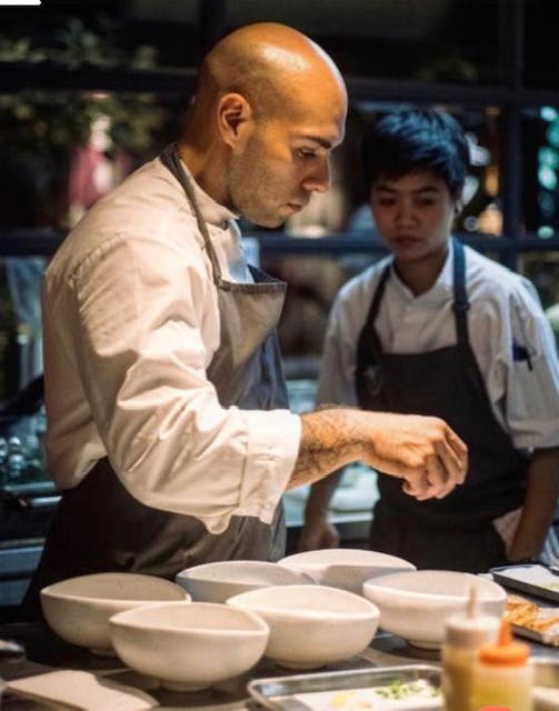 a man preparing food on a table