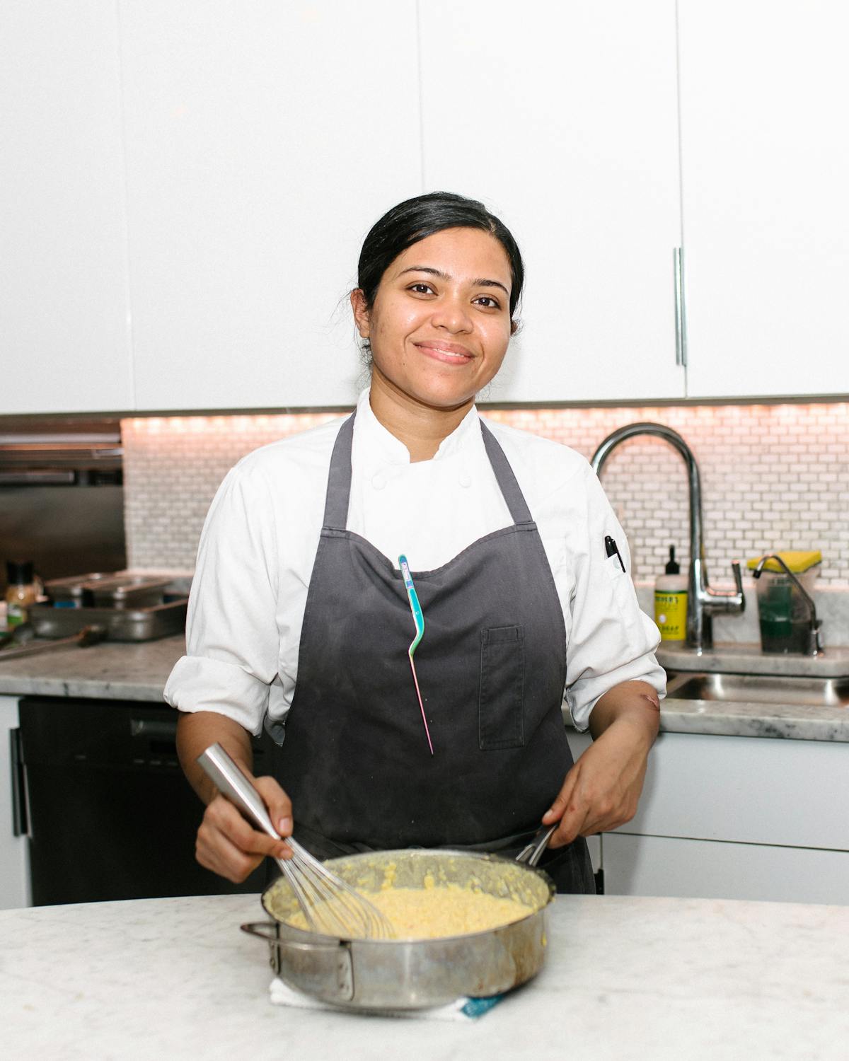 a smiling man in a kitchen