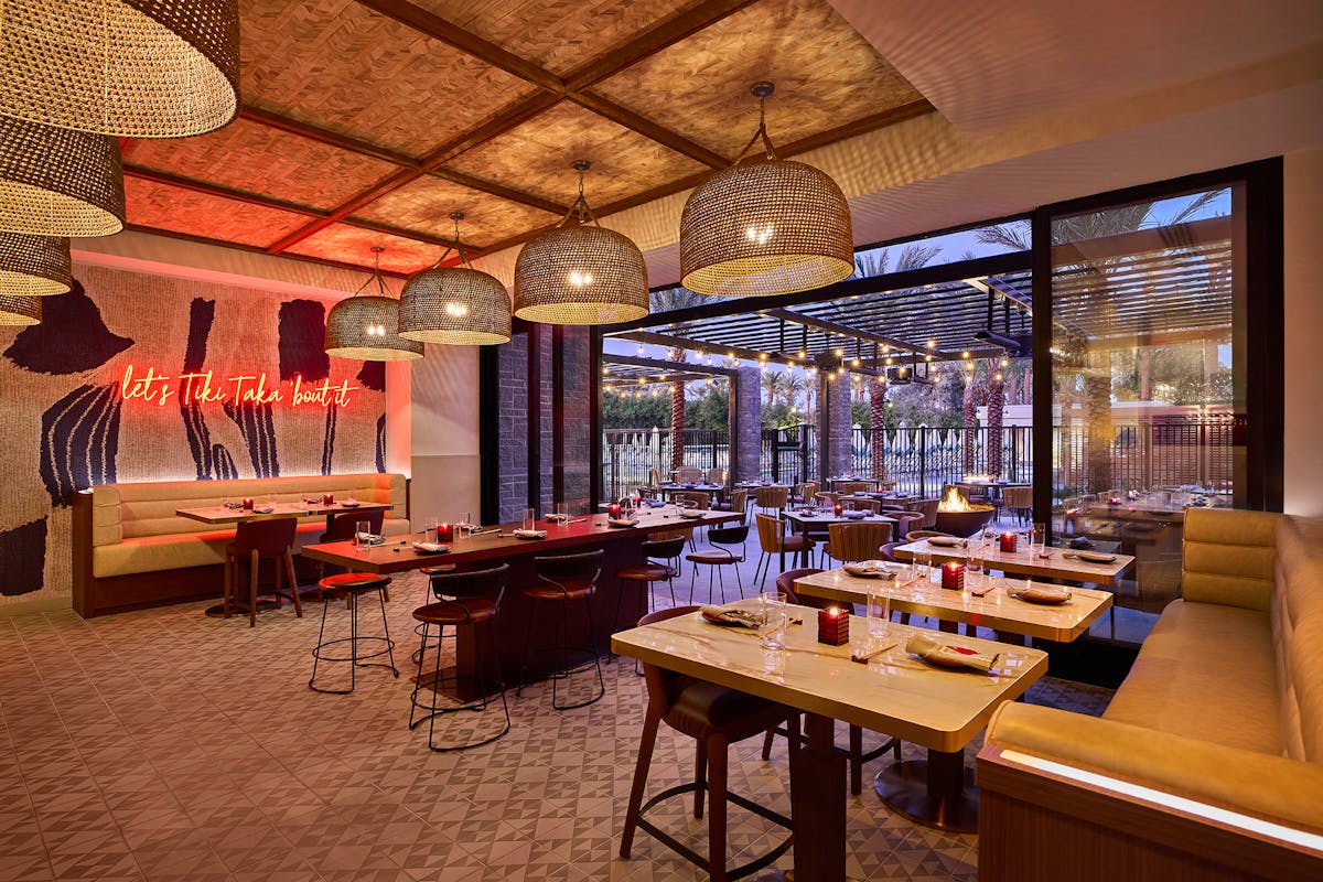 a room filled with furniture and a large window